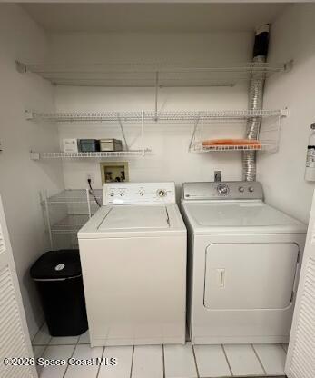 1927 Quail Ridge Court, Unit 1404 Cocoa, FL 32926 - Photo 20 of 23 a utility room with dryer and washer