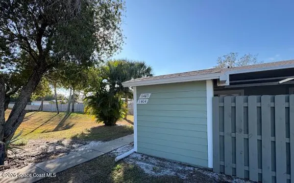 a view of a backyard of the house