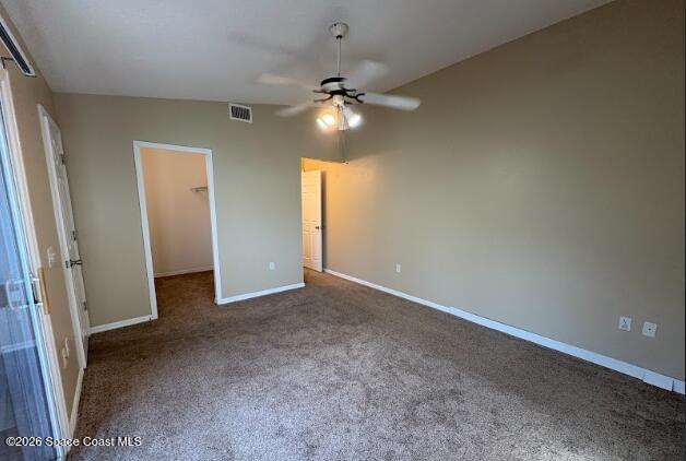 1927 Quail Ridge Court, Unit 1404 Cocoa, FL 32926 - Photo 7 of 23 an empty room with closet and a chandelier fan