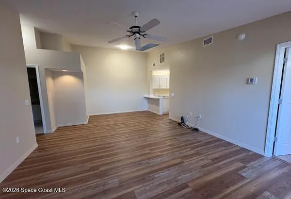 a view of empty room with windows