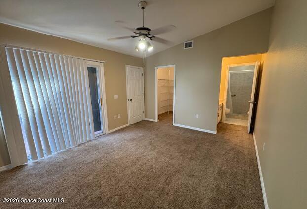 1927 Quail Ridge Court, Unit 1404 Cocoa, FL 32926 - Photo 8 of 23 a view of a hallway with a chandelier fan and windows