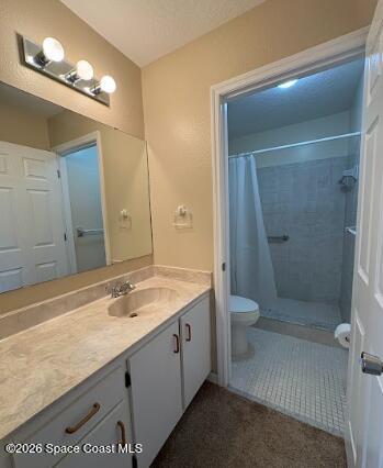 1927 Quail Ridge Court, Unit 1404 Cocoa, FL 32926 - Photo 9 of 23 a bathroom with a granite countertop sink toilet and shower