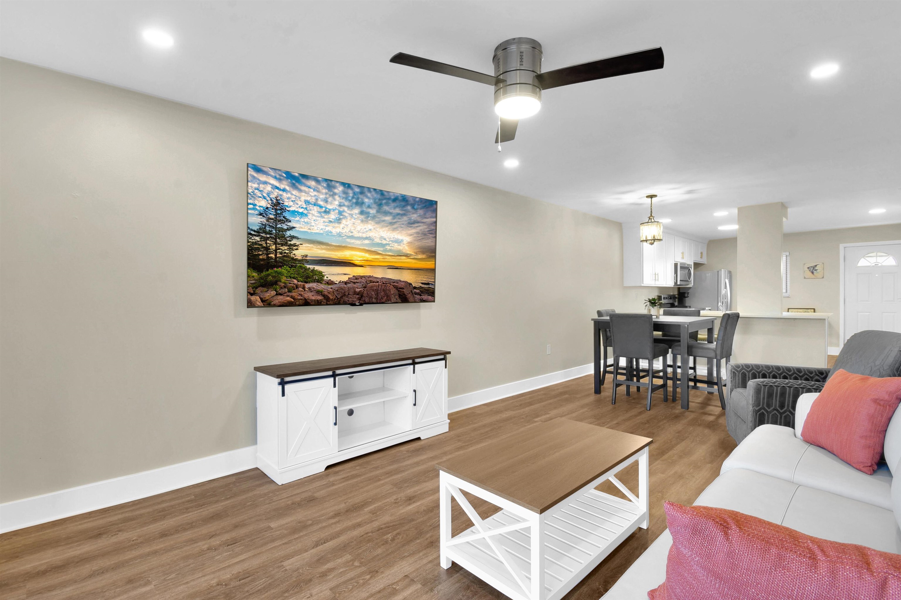 4 Ocean Trace Road, Unit 106 St. Augustine, FL 32080 - Photo 11 of 18 a living room with furniture and a flat screen tv
