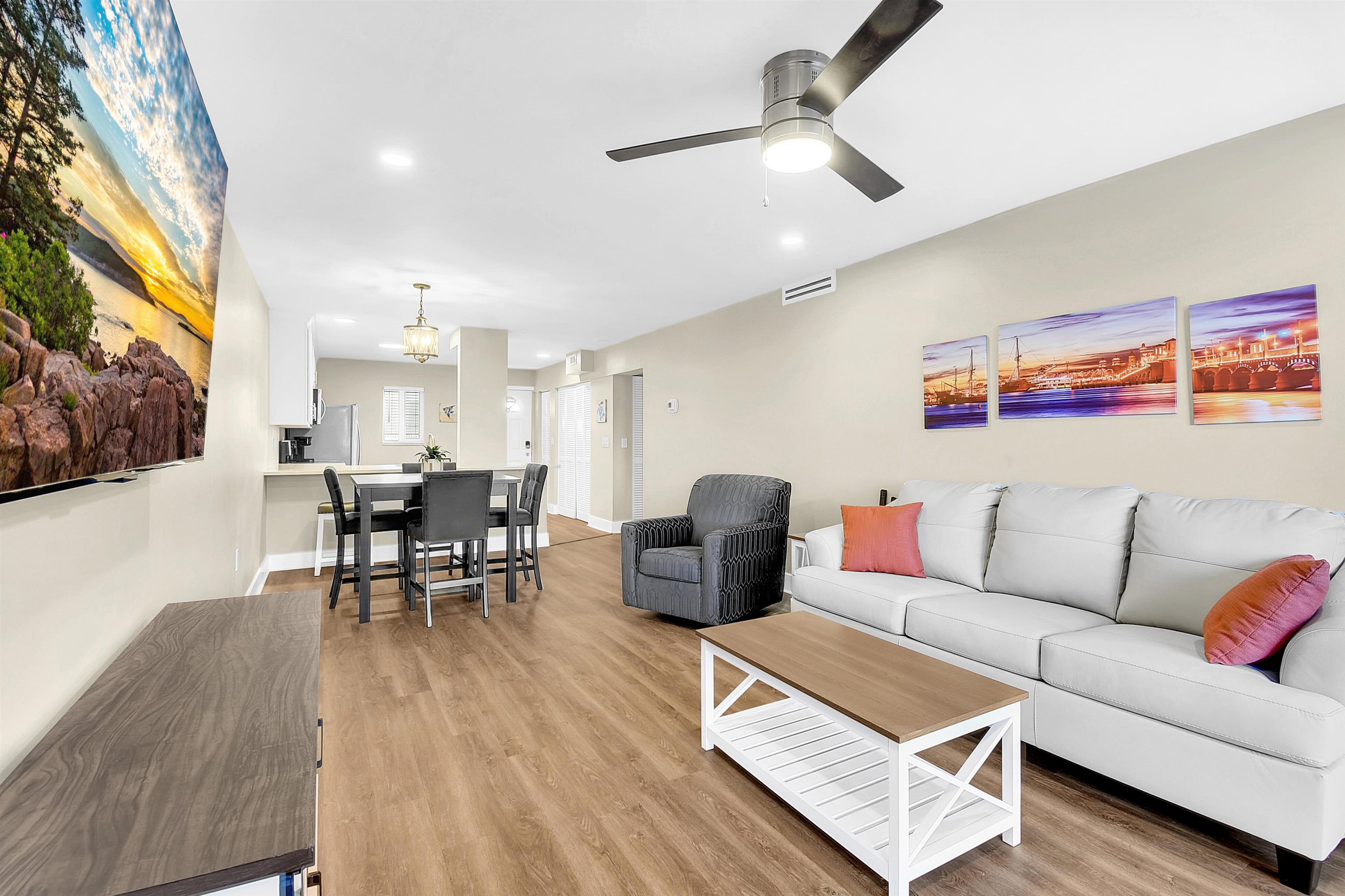 4 Ocean Trace Road, Unit 106 St. Augustine, FL 32080 - Photo 12 of 18 a living room with furniture and a large window