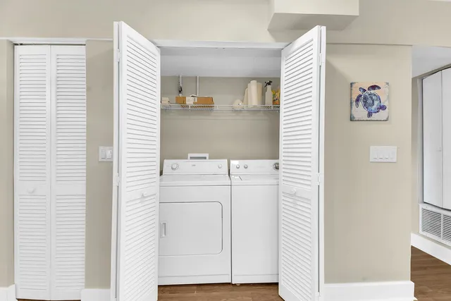 a kitchen with a sink cabinets and stainless steel appliances
