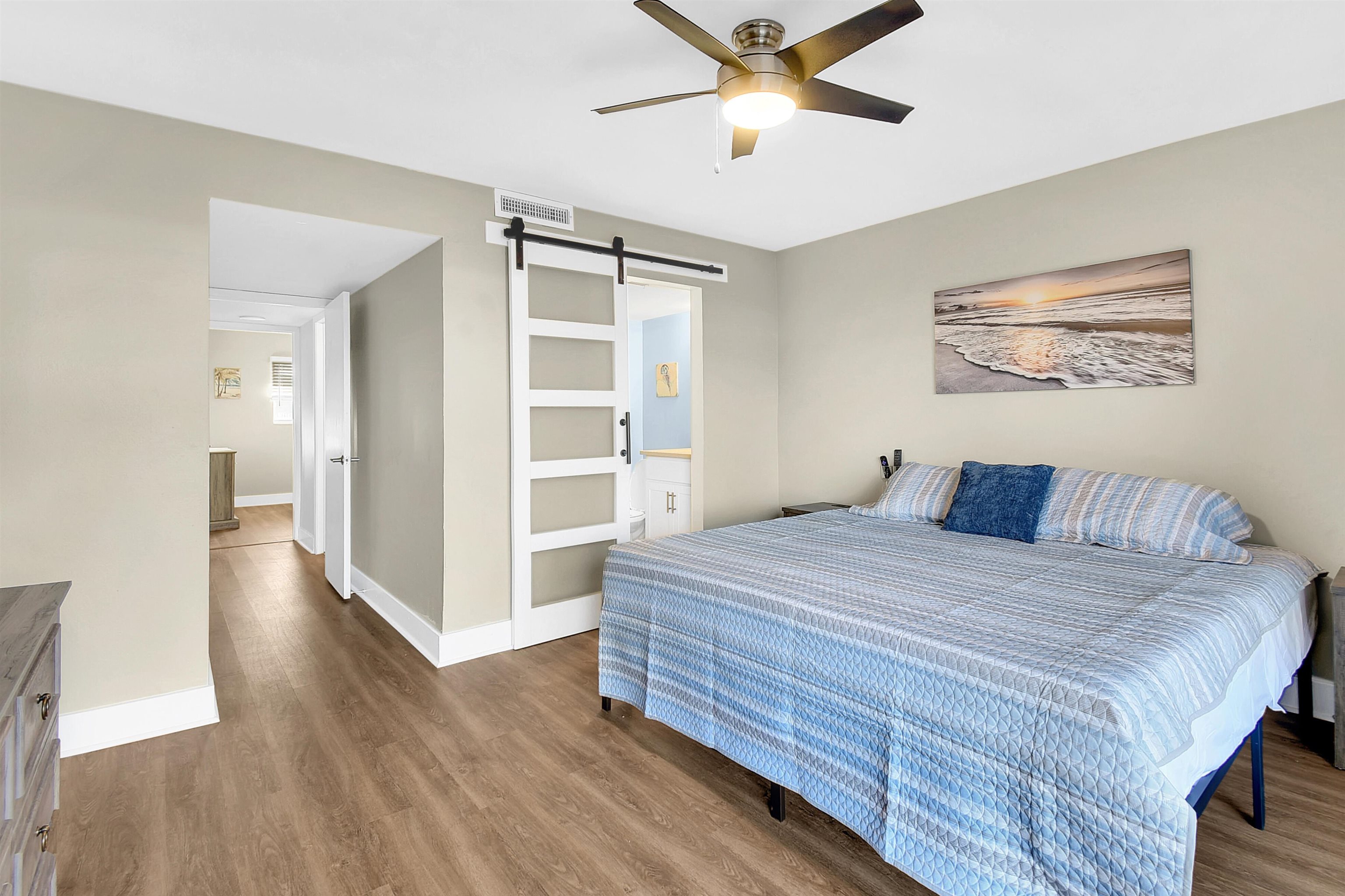 4 Ocean Trace Road, Unit 106 St. Augustine, FL 32080 - Photo 18 of 18 a bedroom with a bed and a view of wooden floor