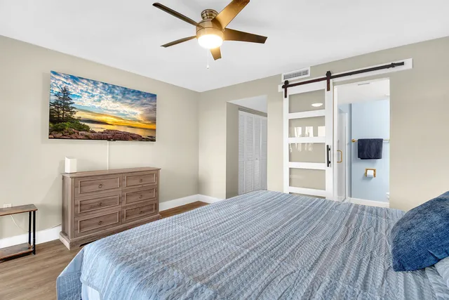 a bedroom with a bed and a dresser