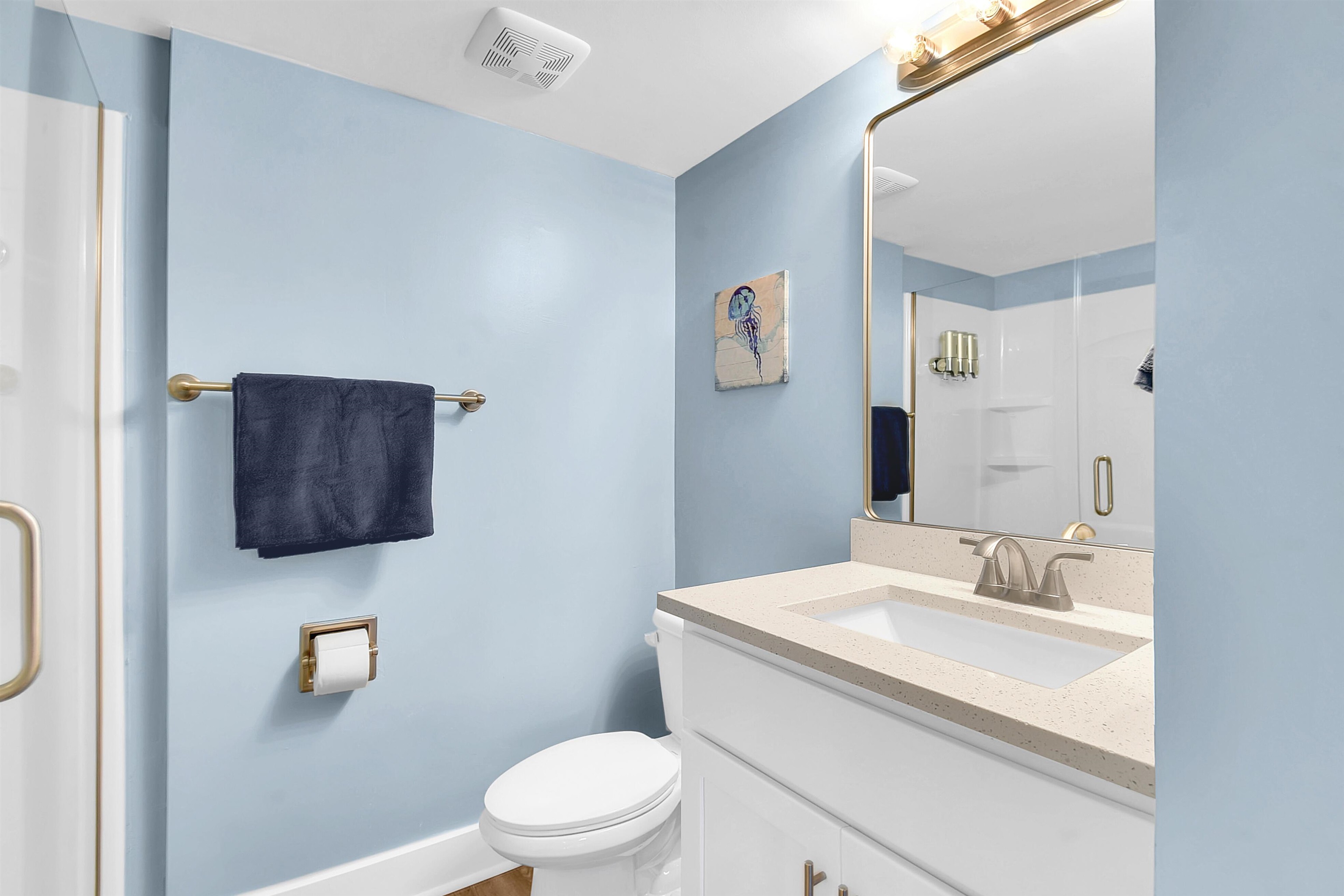 4 Ocean Trace Road, Unit 106 St. Augustine, FL 32080 - Photo 4 of 18 a bathroom with a toilet sink vanity and mirror