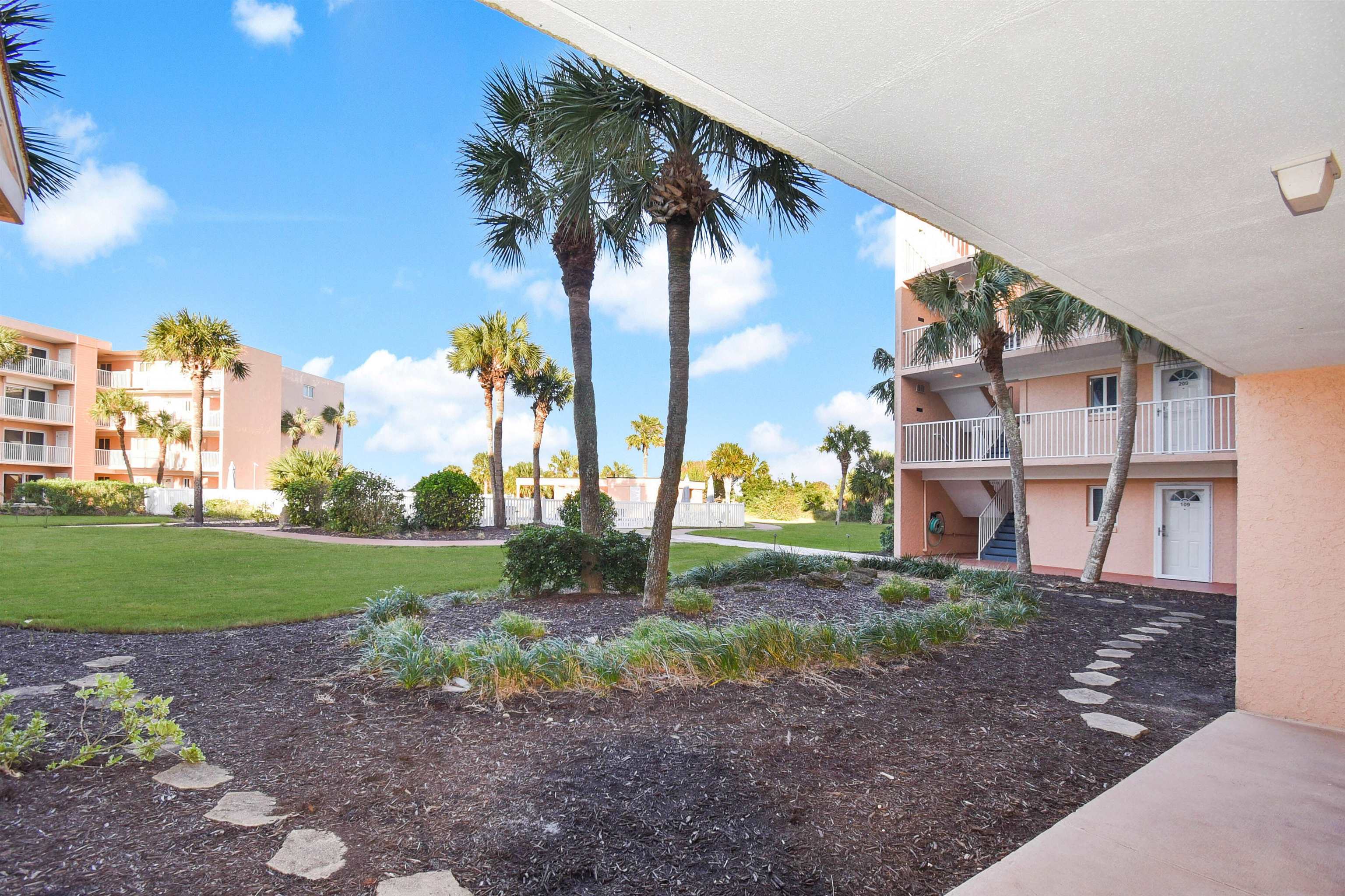 4 Ocean Trace Road, Unit 106 St. Augustine, FL 32080 - Photo 10 of 18 a view of a backyard