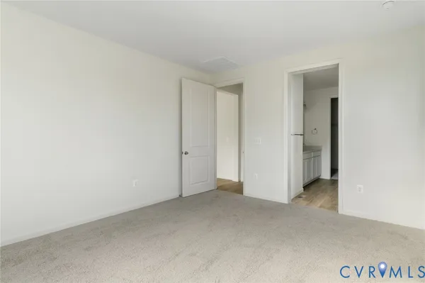 a view of an empty room and closet