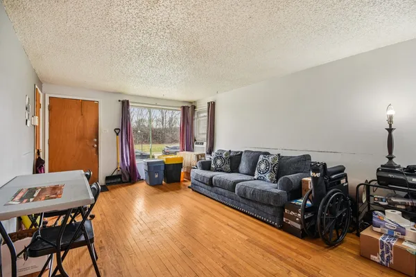 a living room with furniture and a large window