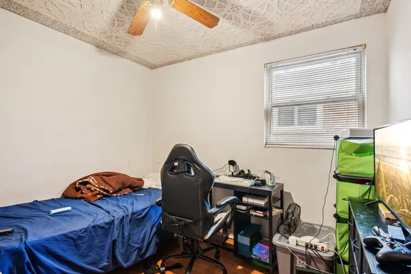 a living room with furniture a window and a flat screen tv