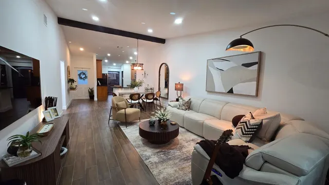 a kitchen with stainless steel appliances wooden floors wooden cabinets and granite counter tops