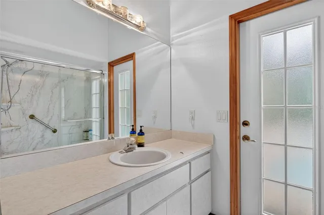 a view of a field with trees in the background