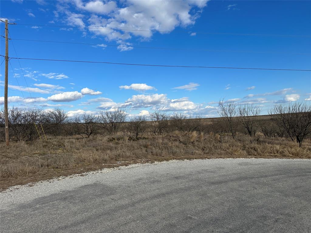 View of asphalt street featuring a view of countryside