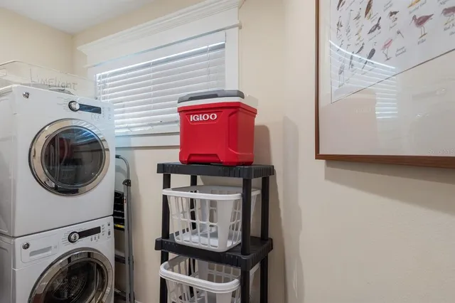 a view of washer and dryer with kitchen in the background