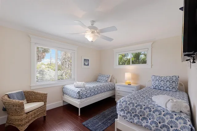 a bedroom with furniture and a window
