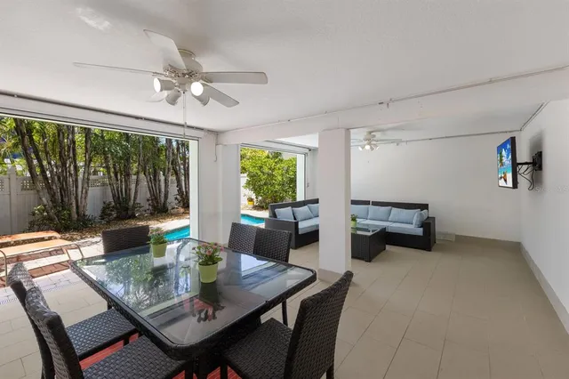 a view of a dining room with furniture window and outside view
