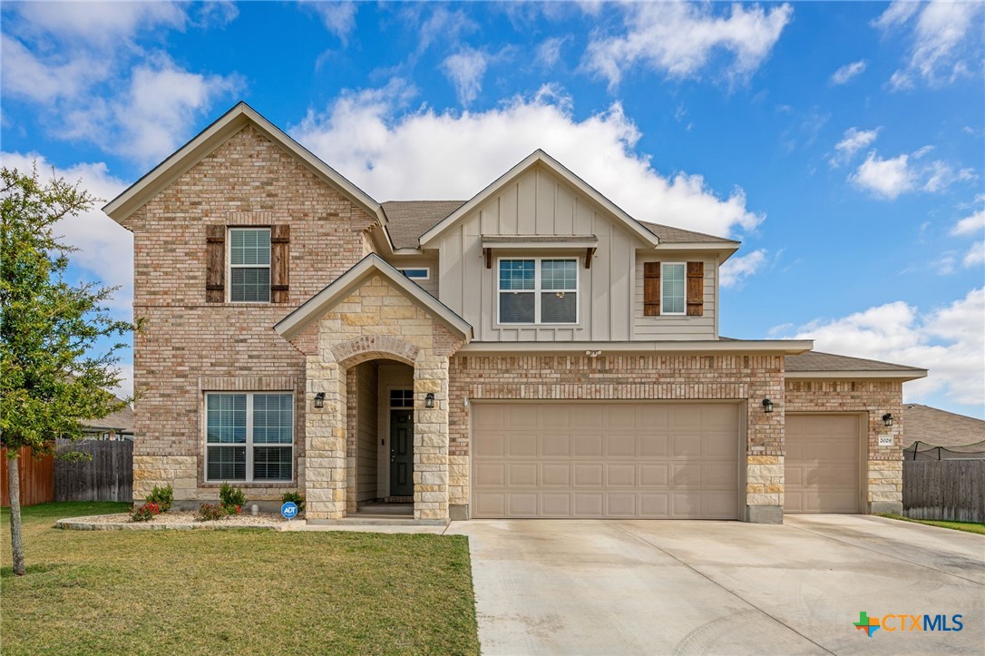 front view of a house with a yard