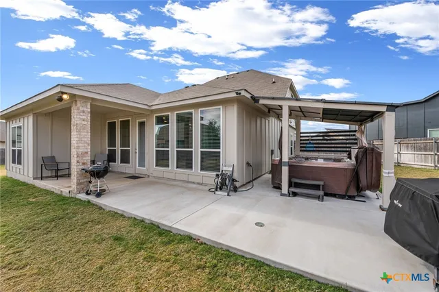 a blue bench sitting in front of a house
