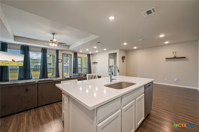 a very nice looking dining room with a large window