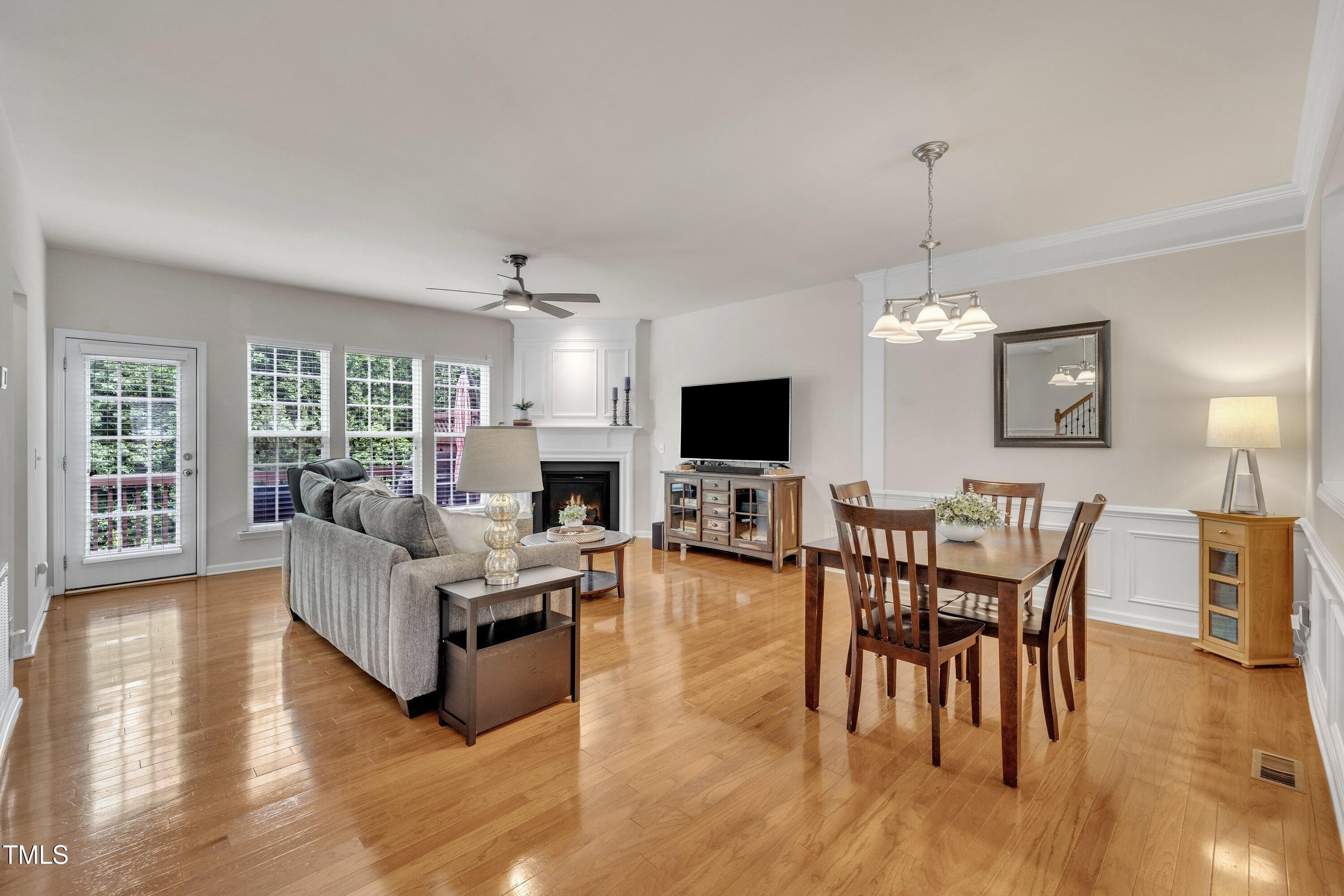 Large open living and dining area with gas fireplace.