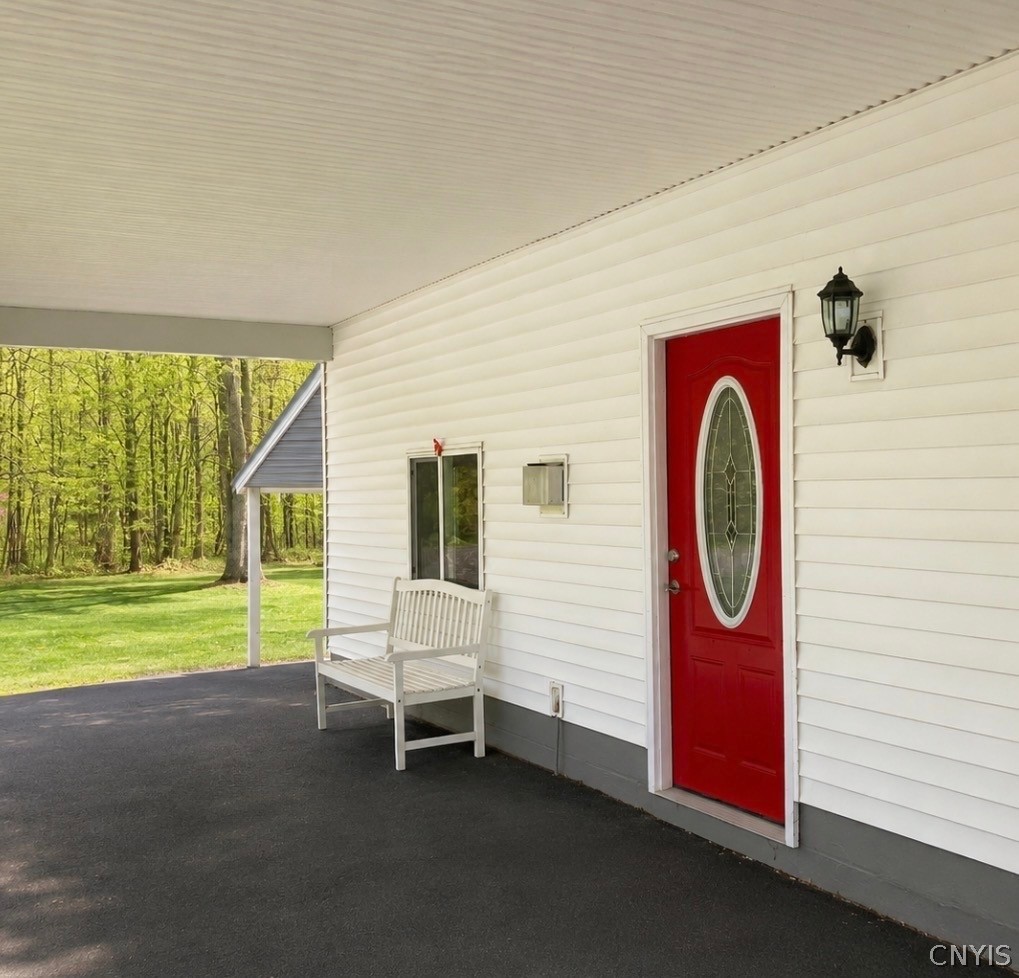 277-283 County Rte 8, Unit 277 Fulton, NY 13069 - Photo 4 of 37 Carport and entrance to apartment