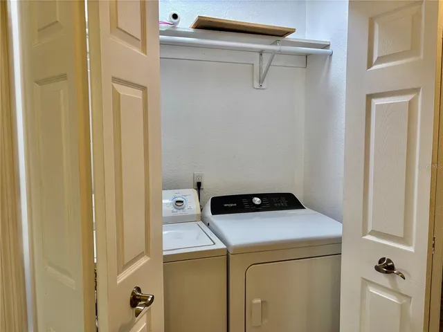 a bathroom with a granite countertop sink toilet and a mirror
