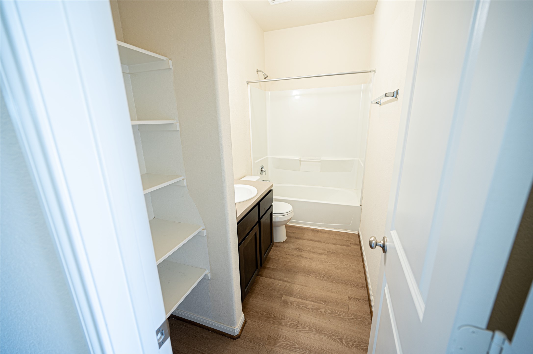 10730 Nathaniel Valley Path Houston, TX 77016 - Photo 11 of 38 a view of a bathroom from the hallway