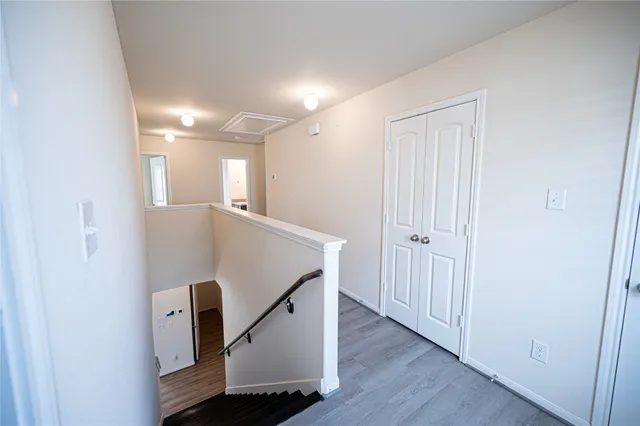 a view of a hallway with staircase