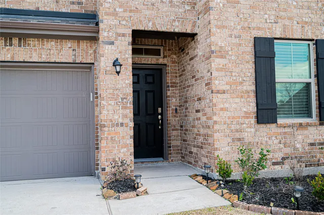 a brick building with a door and a window