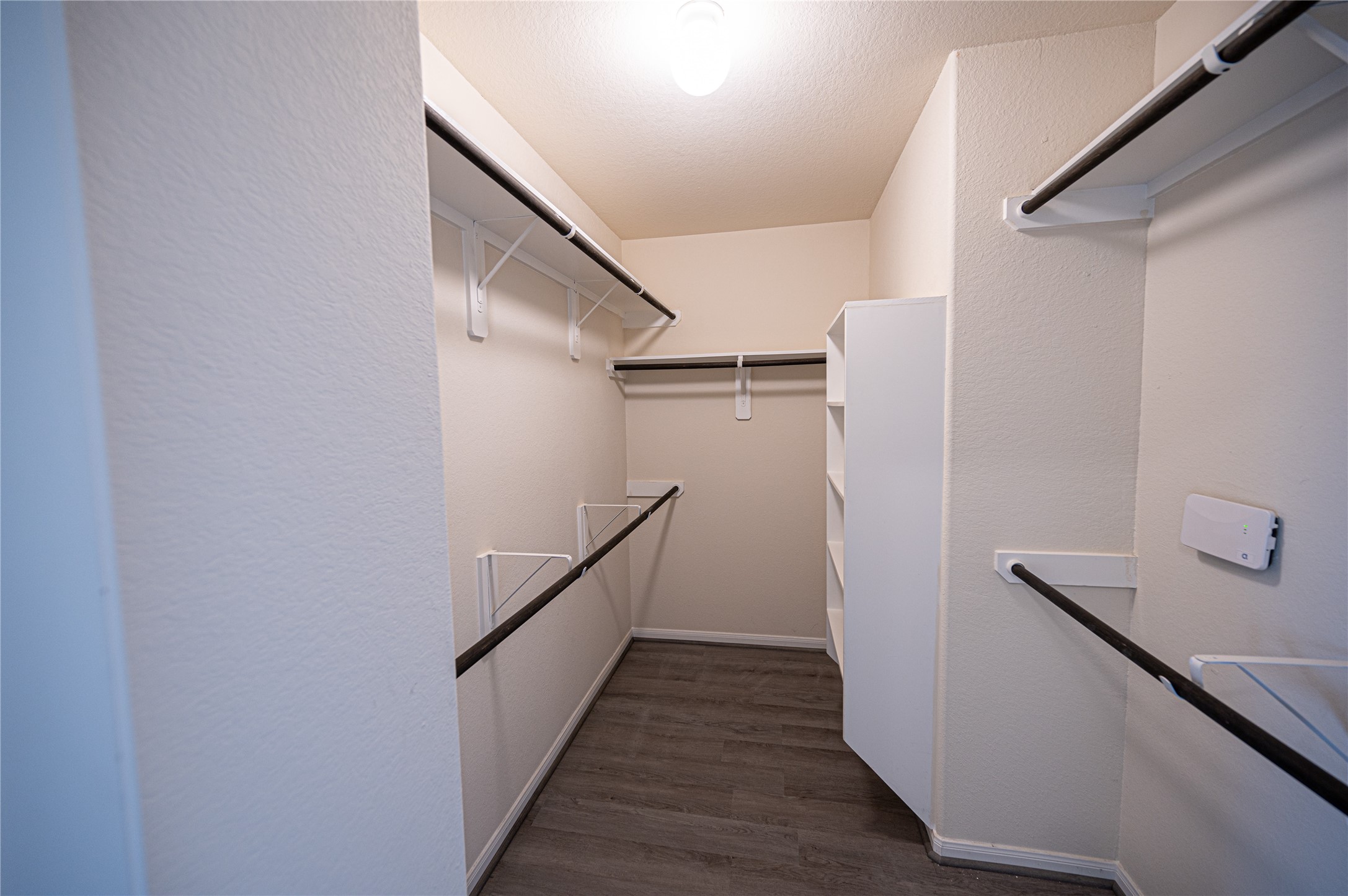 10730 Nathaniel Valley Path Houston, TX 77016 - Photo 22 of 38 a view of a hallway with wooden floor and staircase