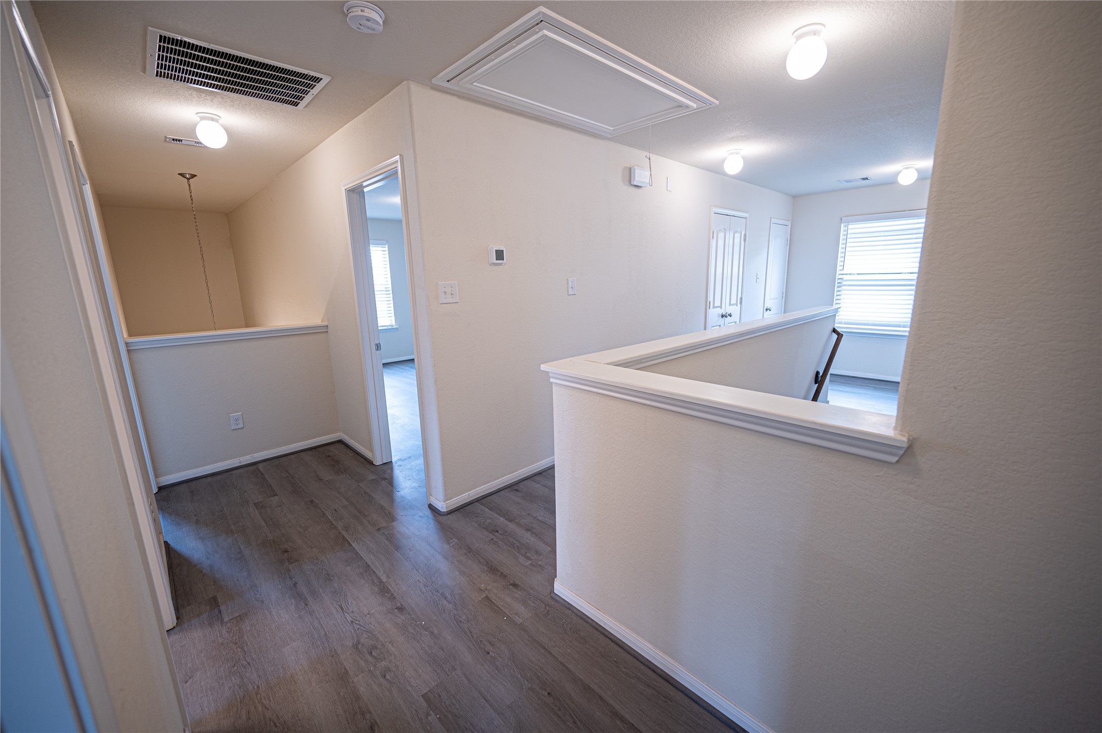 10730 Nathaniel Valley Path Houston, TX 77016 - Photo 25 of 38 a view of utility room with wooden floor