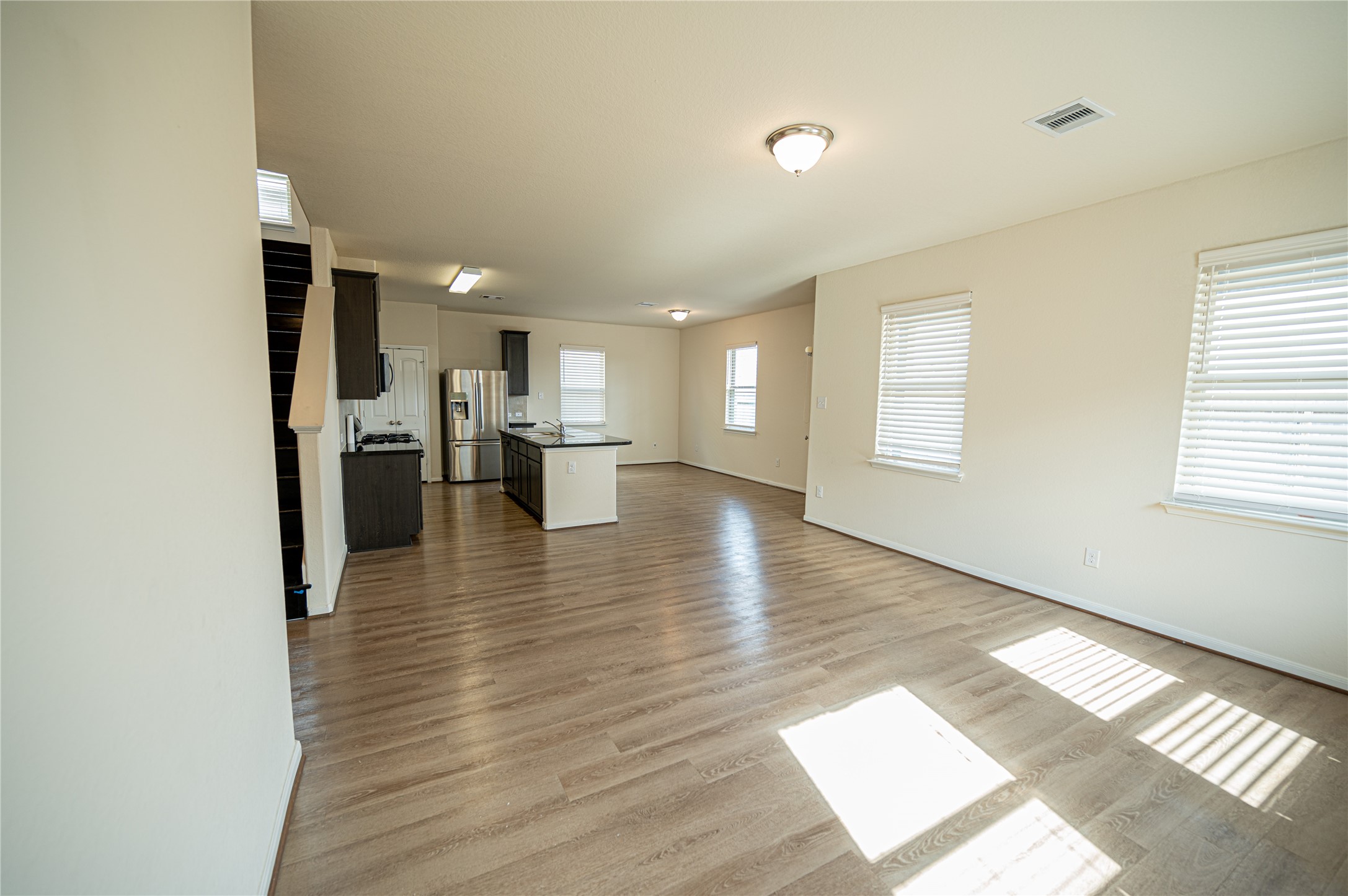10730 Nathaniel Valley Path Houston, TX 77016 - Photo 4 of 38 a view of a living room with hardwood floor and a window