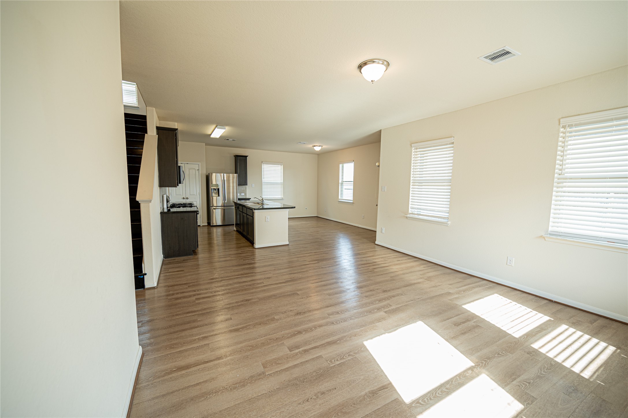 10730 Nathaniel Valley Path Houston, TX 77016 - Photo 8 of 38 a view of a living room with hardwood floor and a window