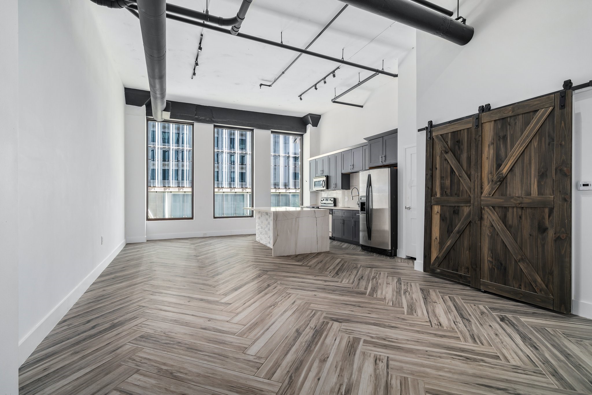 705 Main Street, Unit 206 Houston, TX 77002 - Photo 2 of 27 Elegant porcelain tile floors throughout the common areas.