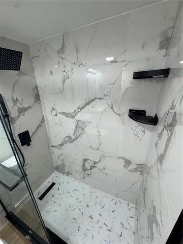 a bathroom with a sink and a shower