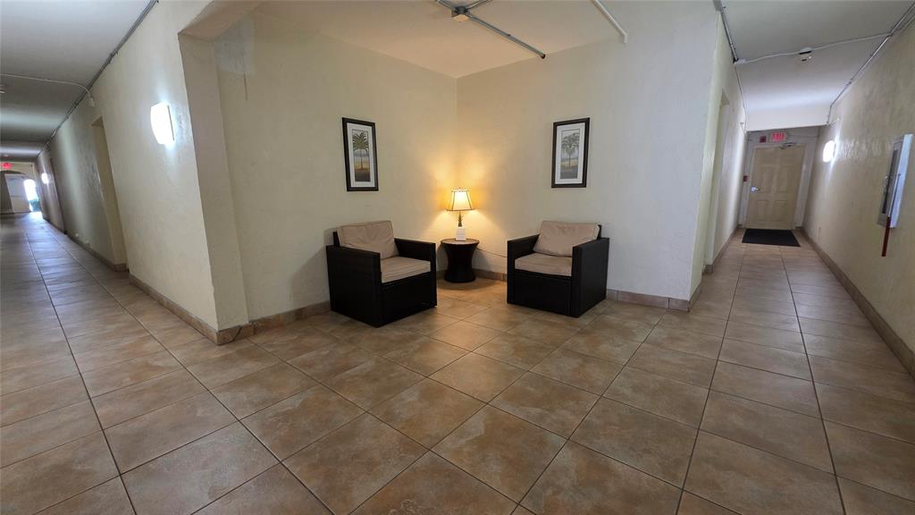 253 South Cypress Road, Unit 225 Pompano Beach, FL 33060 - Photo 20 of 23 a living room with furniture and a couch