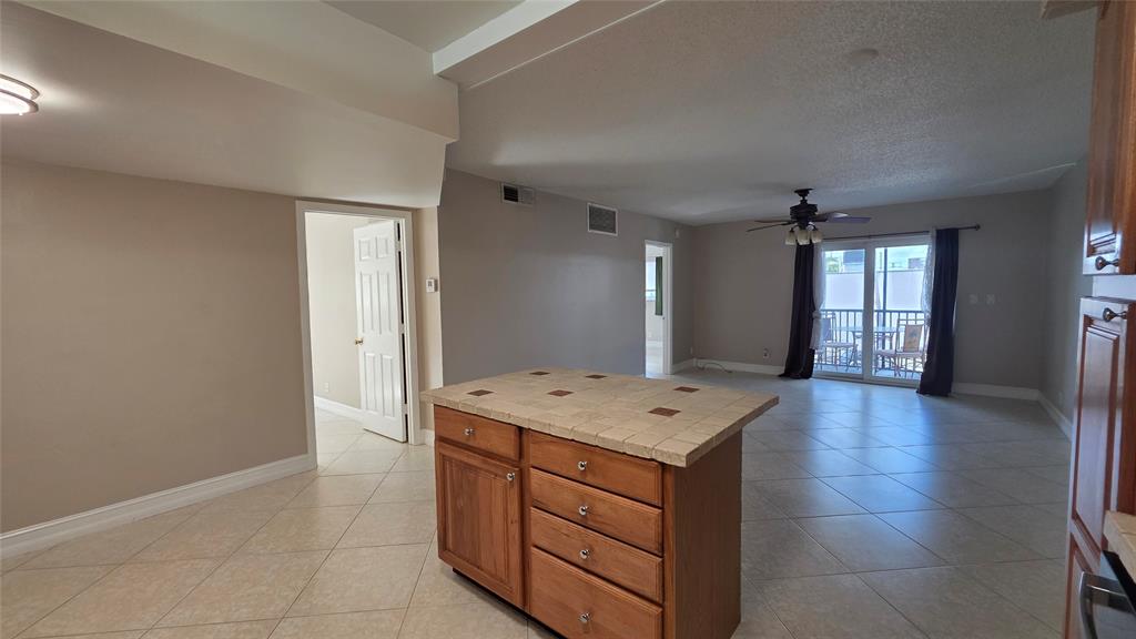 253 South Cypress Road, Unit 225 Pompano Beach, FL 33060 - Photo 2 of 23 a view of kitchen with cabinets