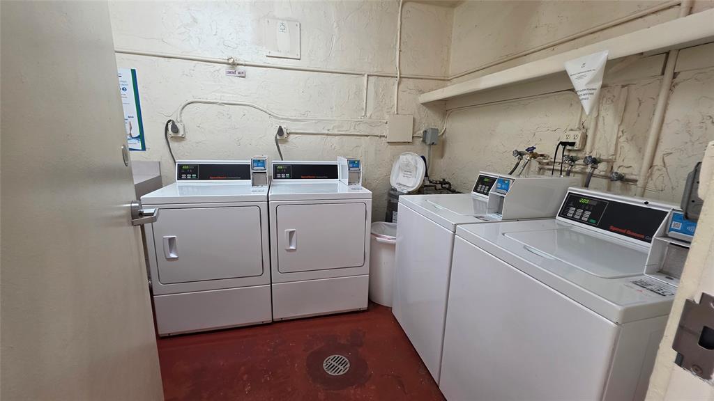 253 South Cypress Road, Unit 225 Pompano Beach, FL 33060 - Photo 22 of 23 a utility room with dryer and washer