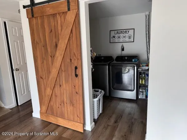 a view of a storage and utility room with a window