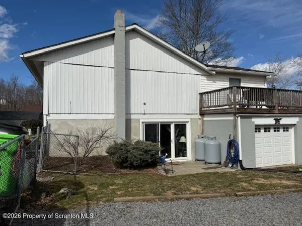 a house view with a backyard space