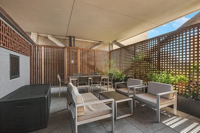 a view of a terrace with couches and potted plants