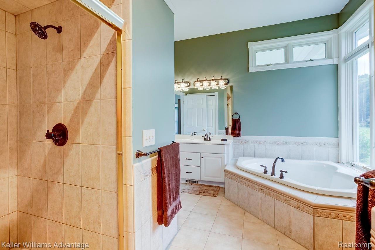 4558 Vines Road Howell, MI 48843 - Photo 13 of 46 Huge 2 person ceramic shower with dual heads