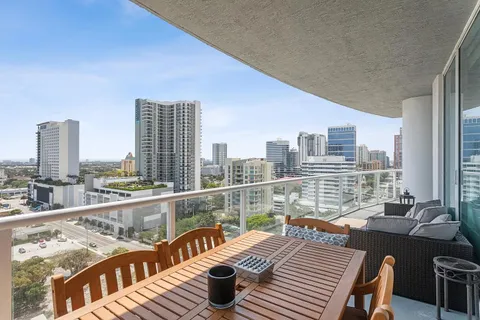 a view of a balcony with two chairs and a table