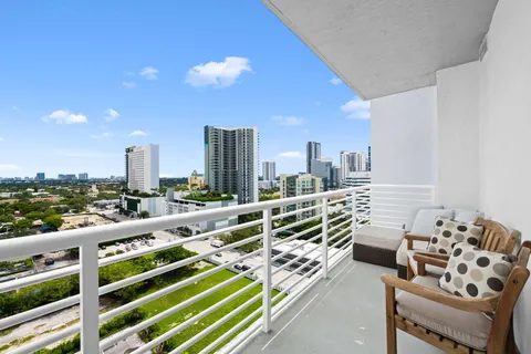 a view of balcony with furniture