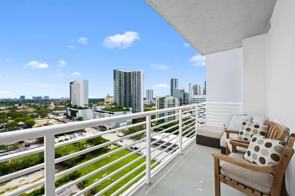 a view of balcony with furniture