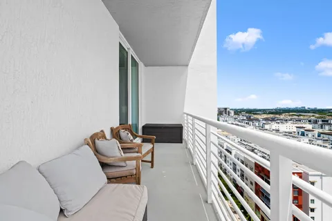 a balcony view with chairs
