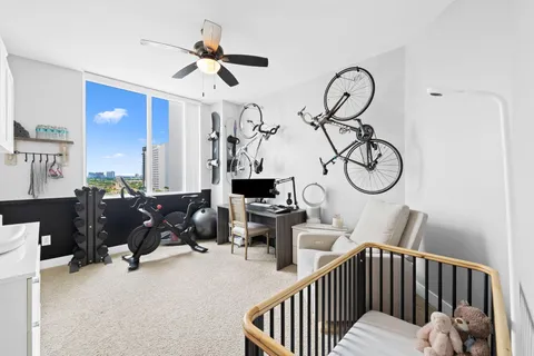 a bedroom with furniture and a window