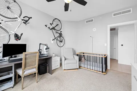 a view of a room with lots of white furniture